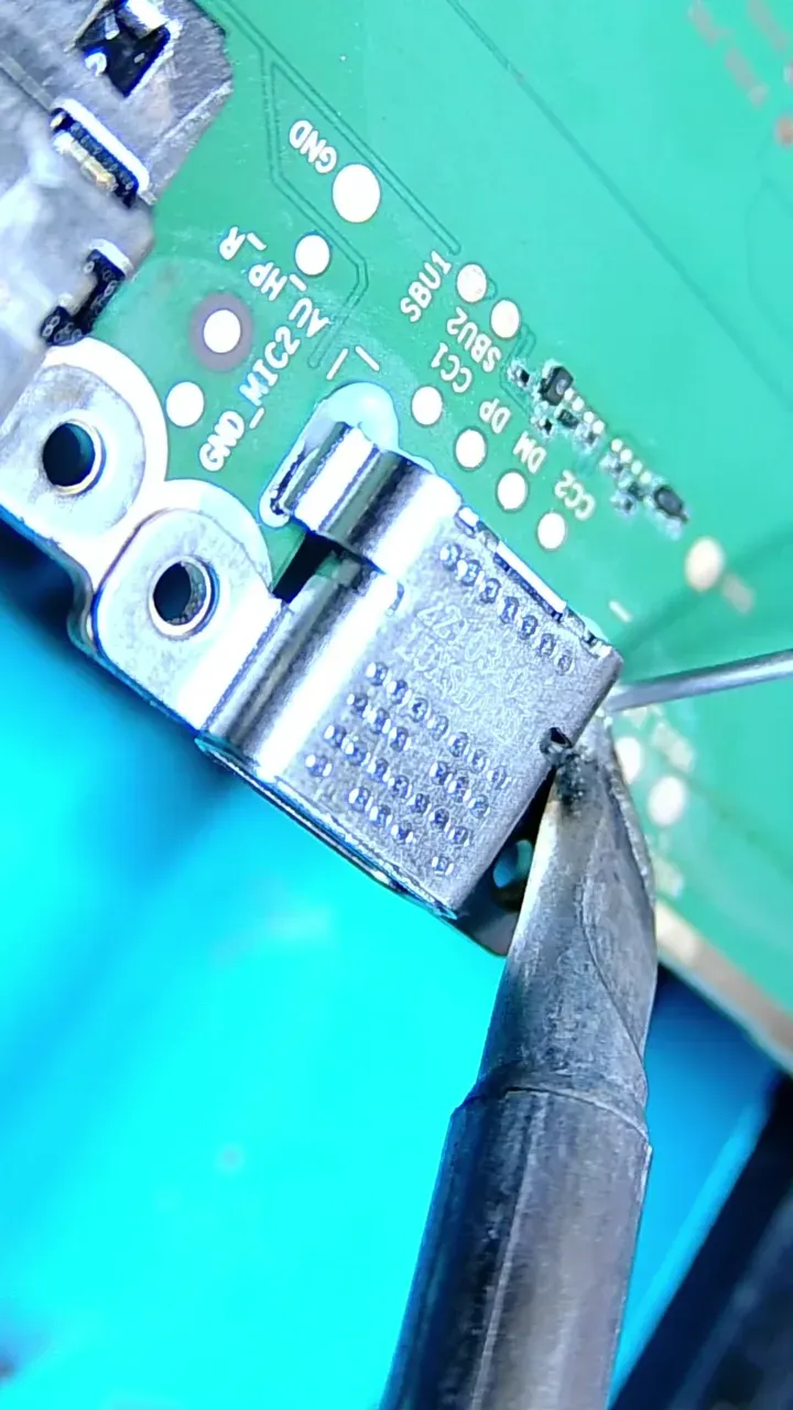 Replacement USB-C connector being fitted to an Amazon Fire HD 8 10th generation board